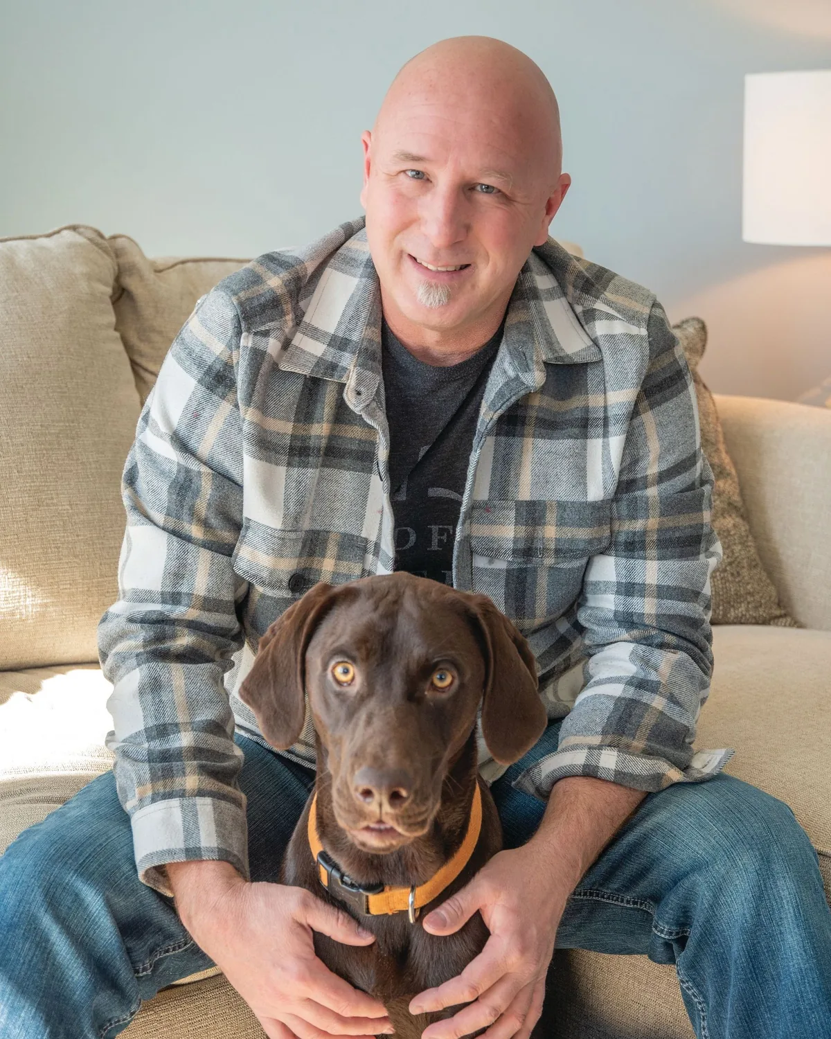 Jay DeBoyer at home with his dog