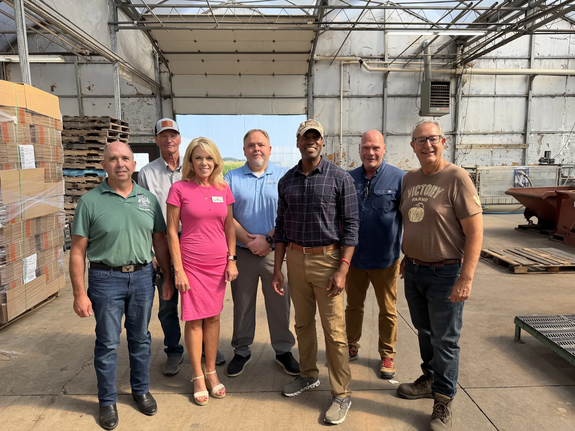 John James with the team at a Michigan business