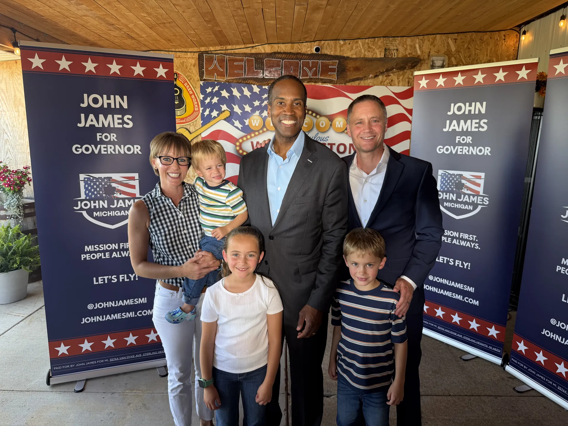 John James with a Michigan family at a campaign event