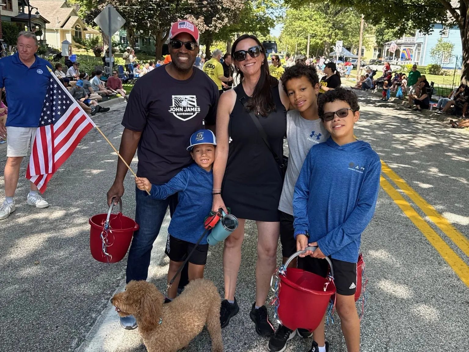 John James with his family at a Fourth of July parade
