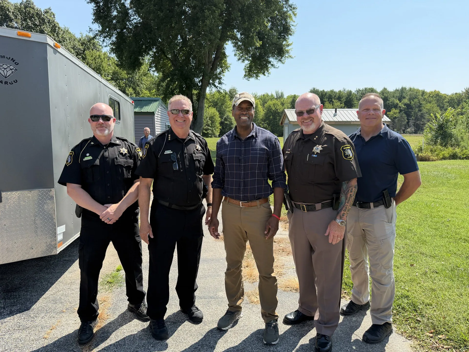 John James with Michigan law enforcement officers