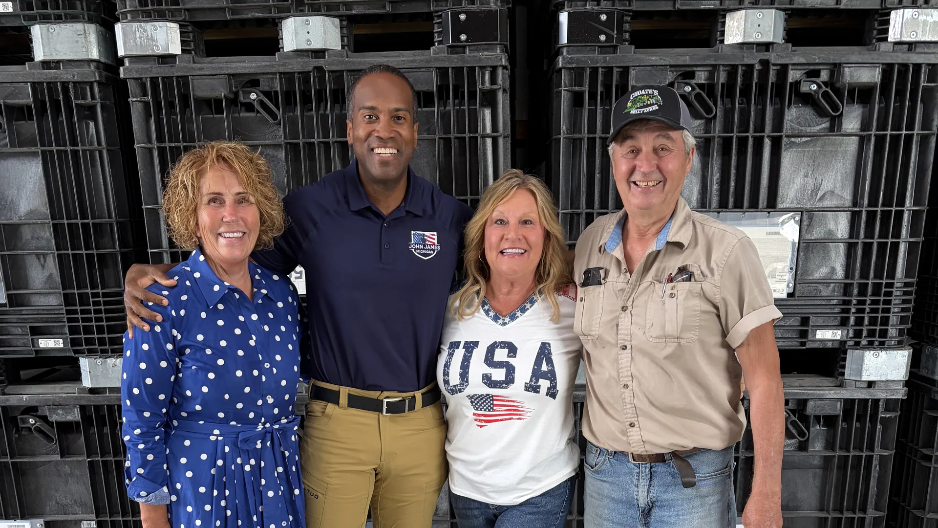 John James with supporters at a Michigan small business