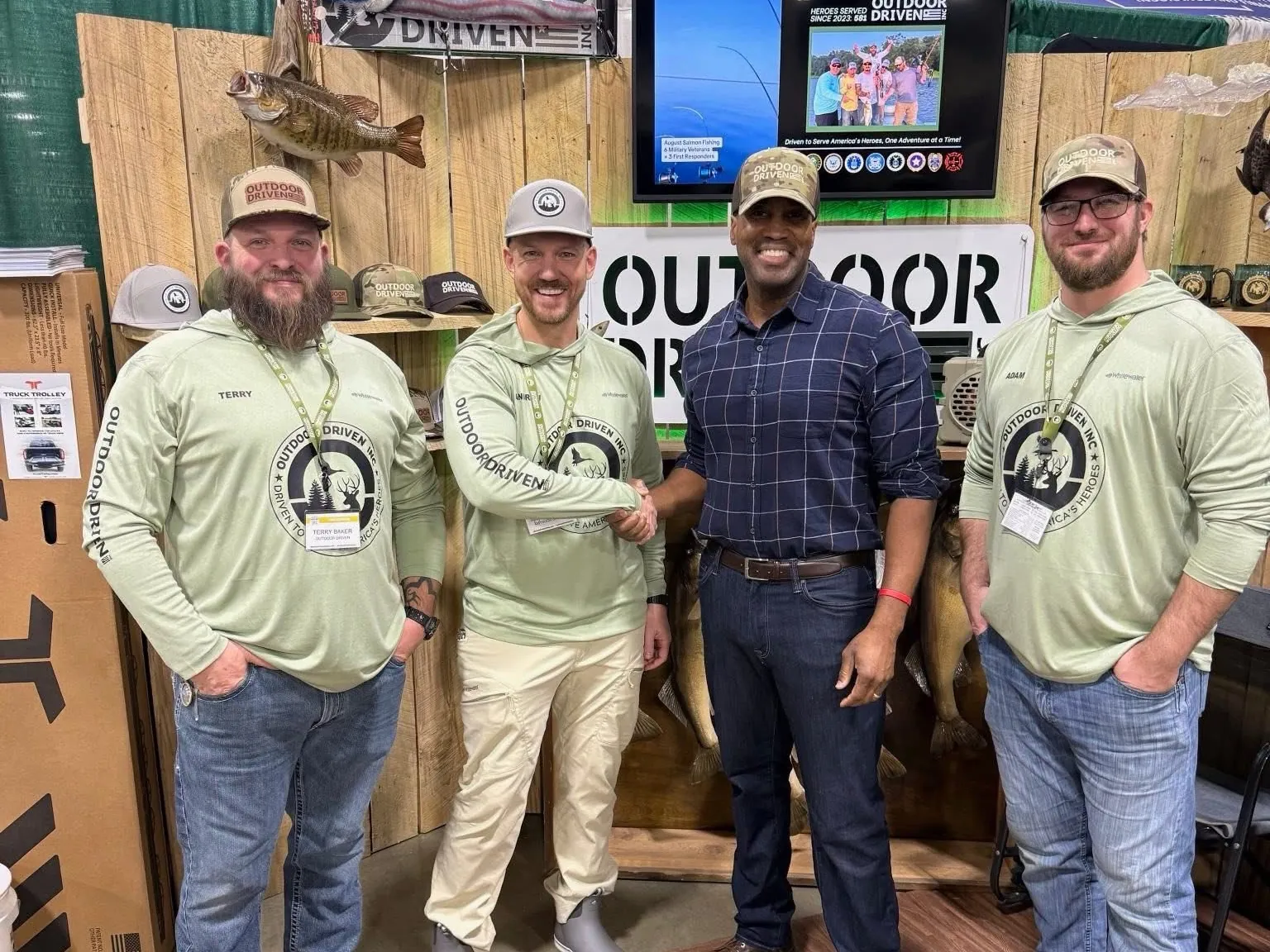John James with Michigan sportsmen at an outdoor show